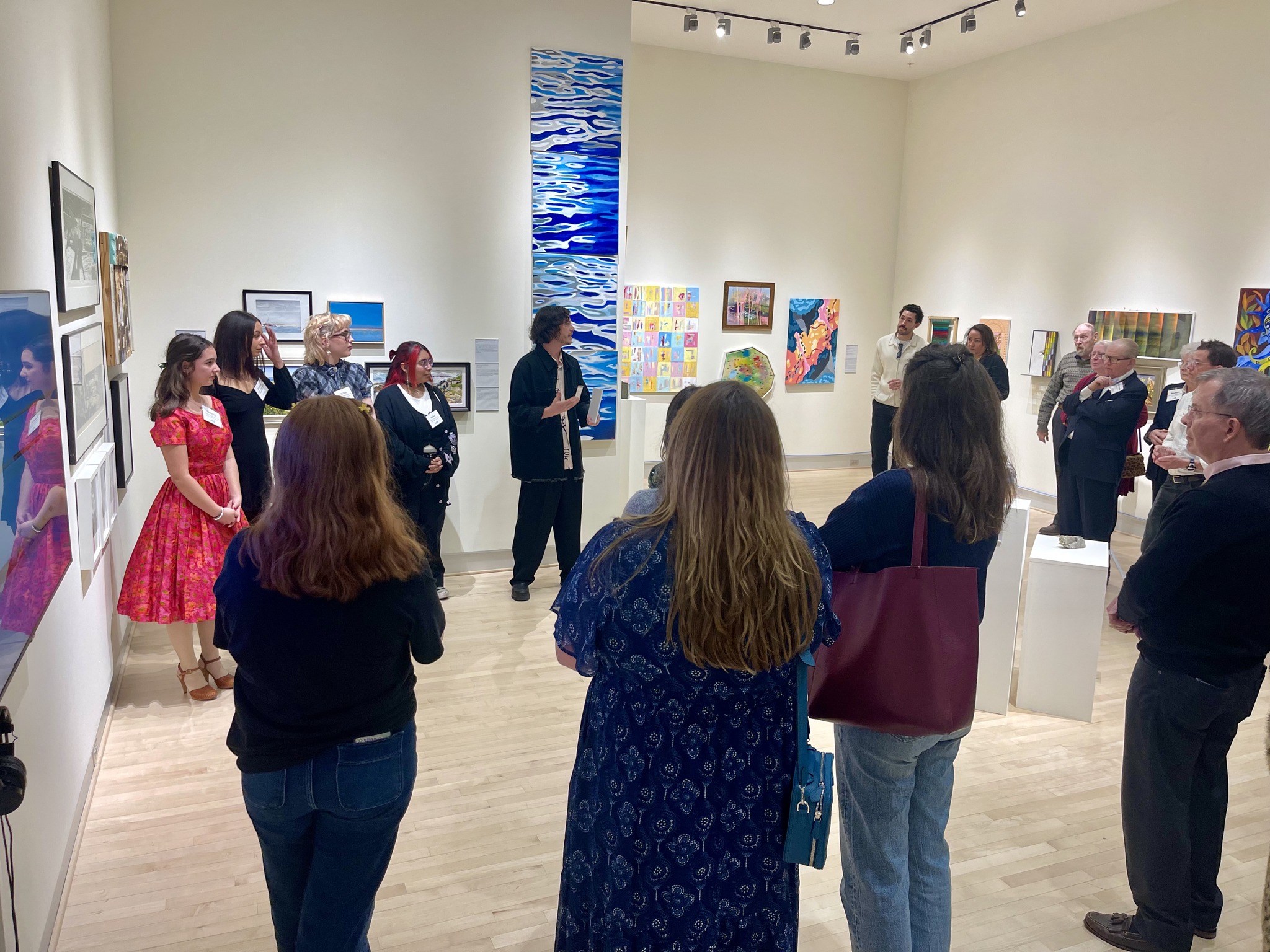 Alumni and friends attending a gallery reception