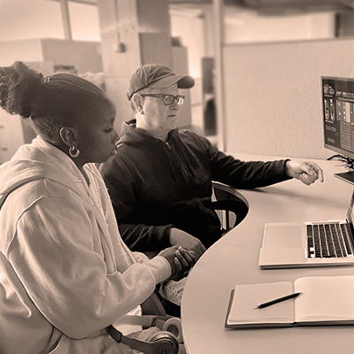 Two students working together at a workstation at the GRC