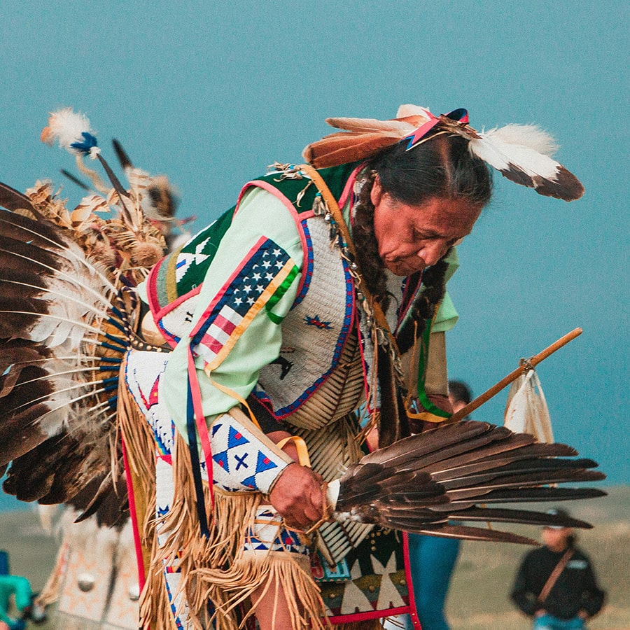 Lakota Native American Man at Pow Wow - photo by Andrew James Unsplash