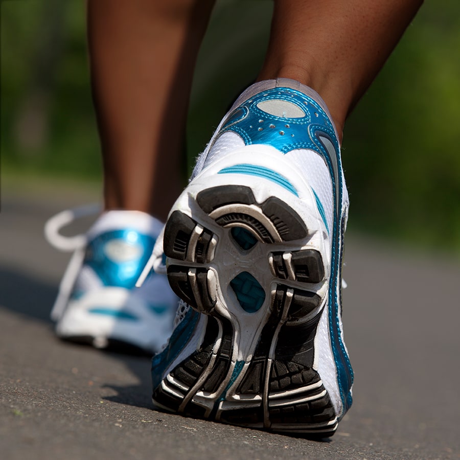 close up of running shoes worn by POC